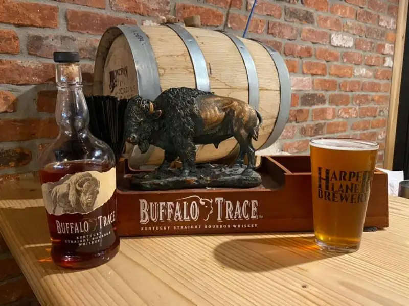 Buffalo Trace bourbon with a bison figure and a draft beer